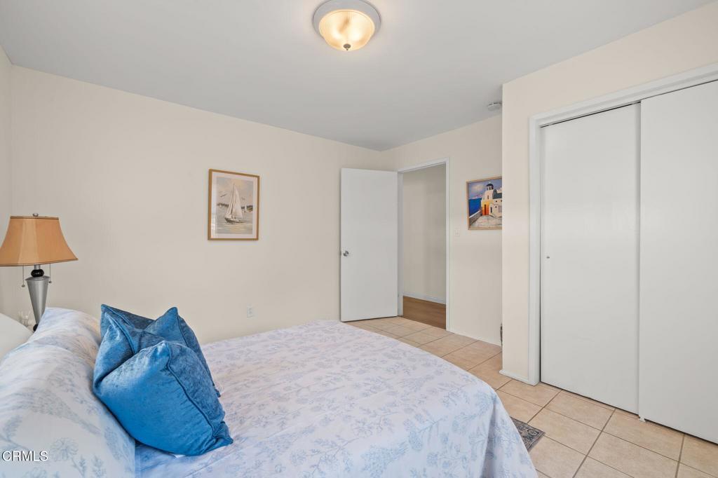 4025 Maxson Road El Monte, CA 91732 - Photo 22 of 27 a bedroom with a bed and a lamp