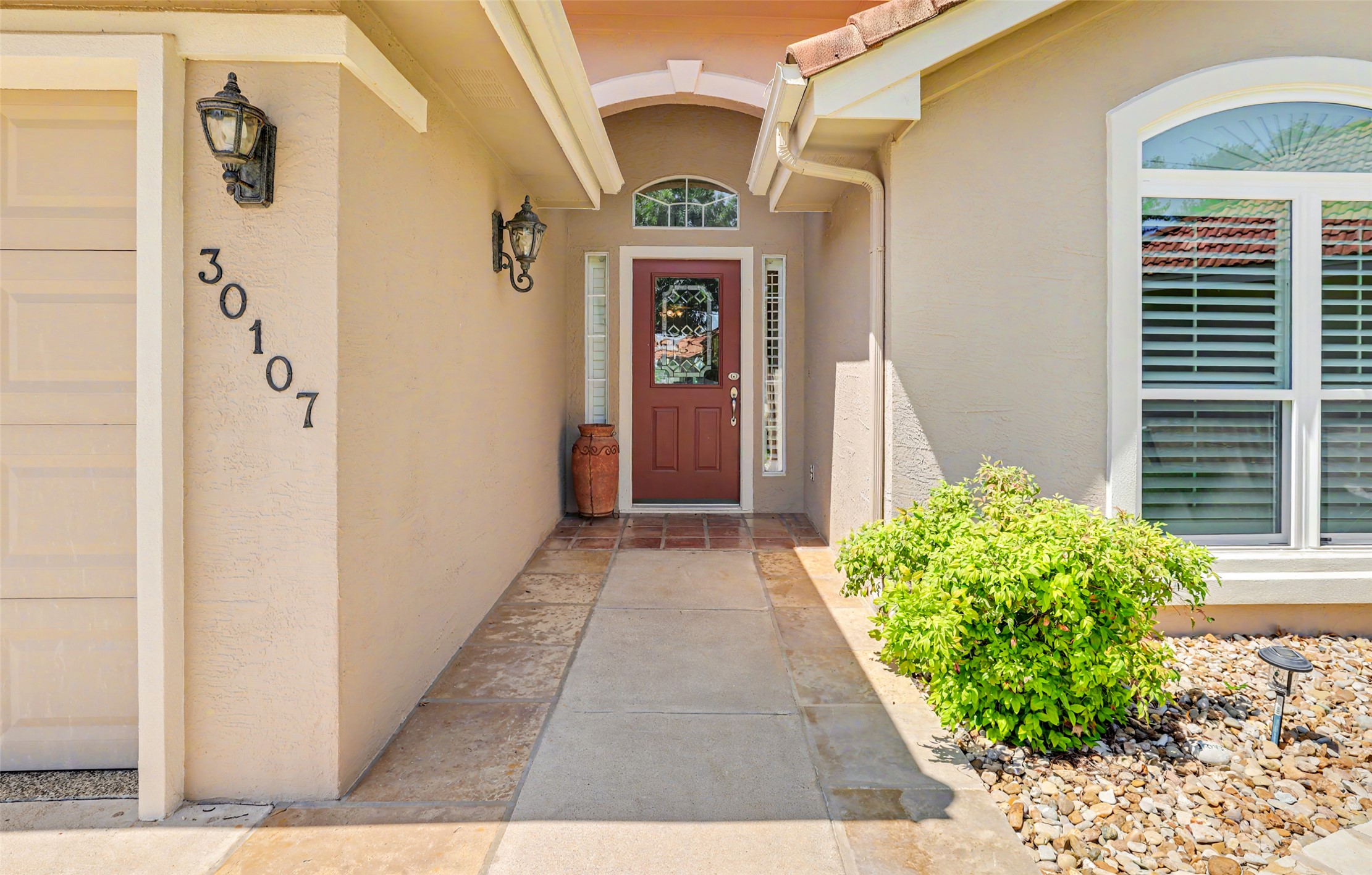 30107 Hamlet Circle Georgetown, TX 78628 - Photo 2 of 40 A terracotta tiled entry leads to a classic front door, welcoming you inside.