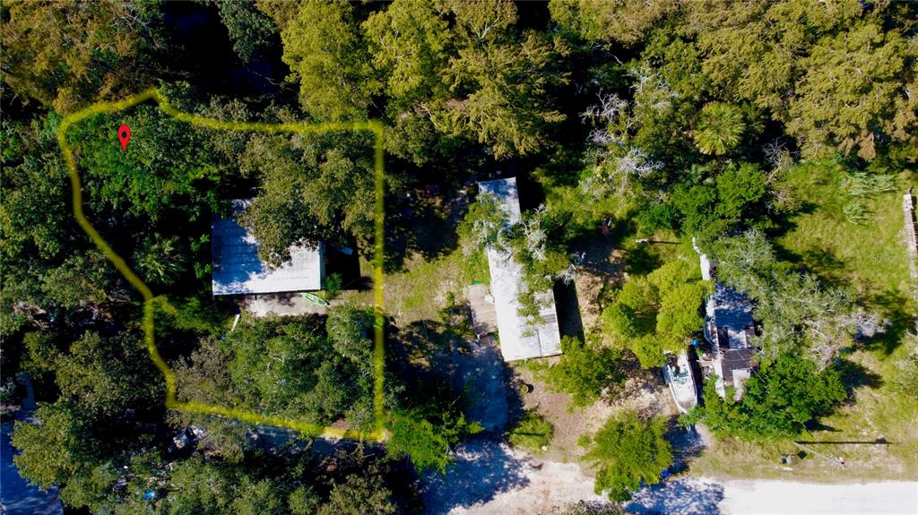 12 Riverrun Road New Port Richey, FL 34655 - Photo 1 of 1 an aerial view of a house with a yard