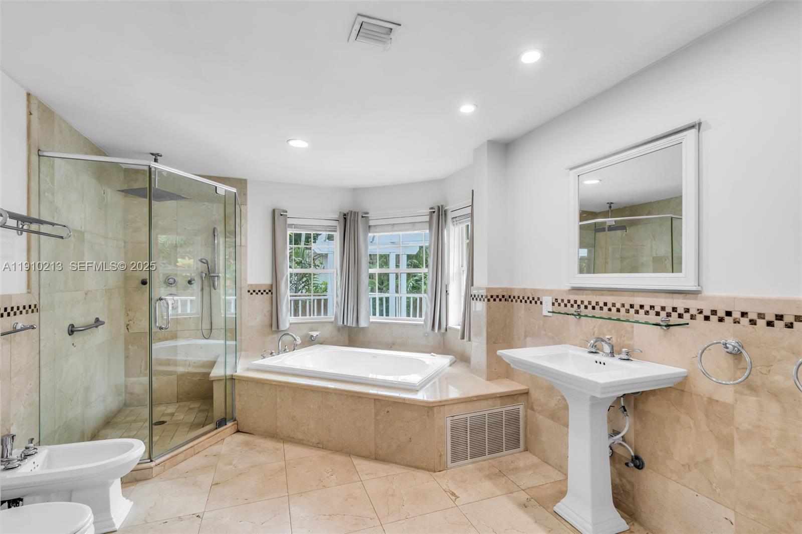 4416 Southwest 14th Street Miami, FL 33134 - Photo 15 of 33 a spacious bathroom with a tub sink shower and mirror