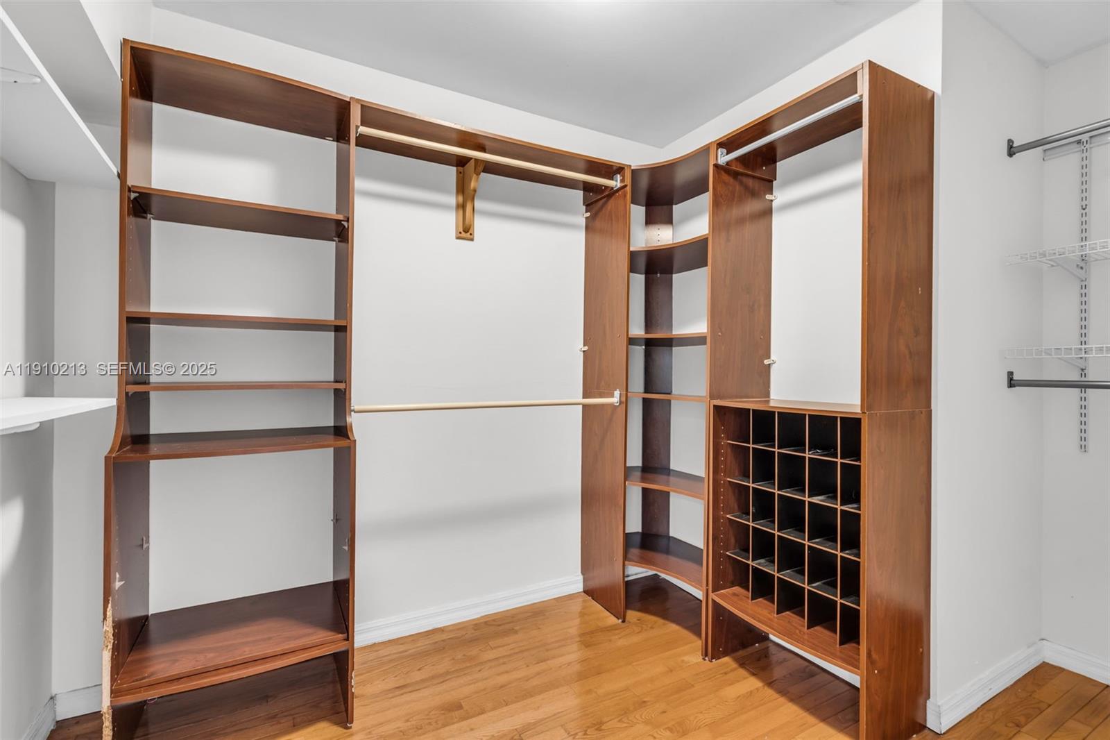 4416 Southwest 14th Street Miami, FL 33134 - Photo 17 of 33 a view of walk in closet with empty racks