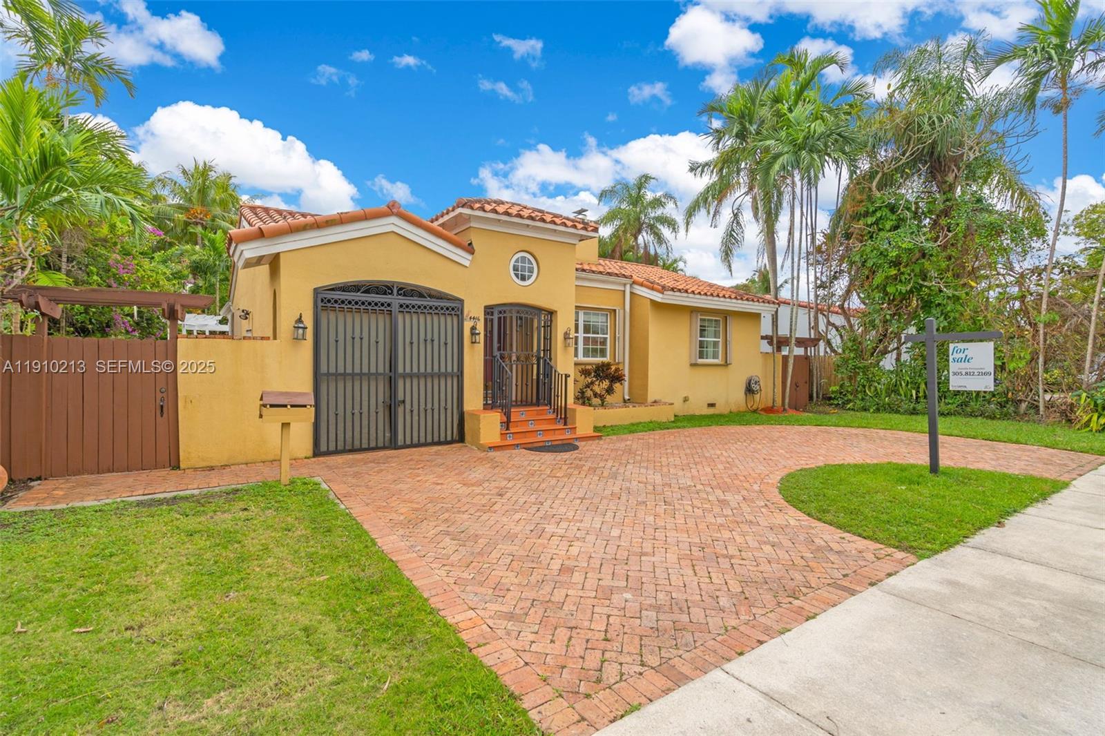 4416 Southwest 14th Street Miami, FL 33134 - Photo 2 of 33 a front view of a house with garden