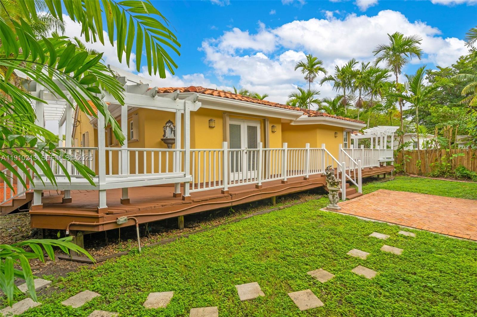 4416 Southwest 14th Street Miami, FL 33134 - Photo 29 of 33 a view of a house with backyard and sitting area