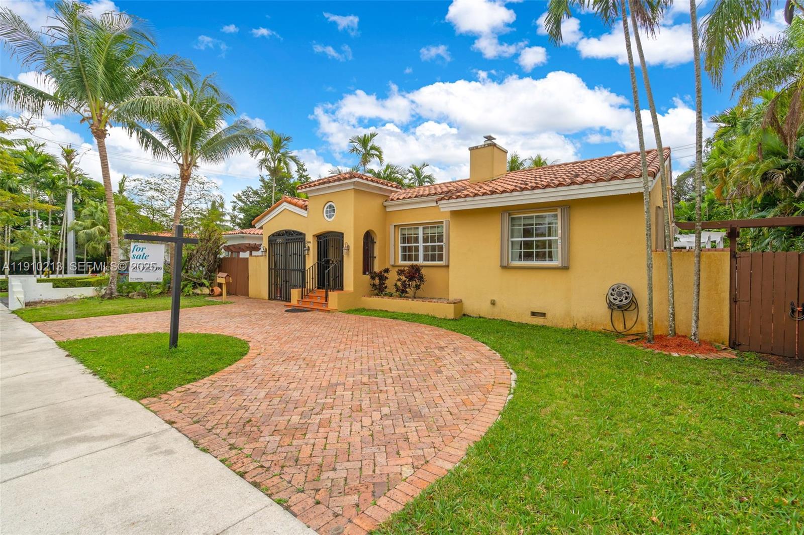 4416 Southwest 14th Street Miami, FL 33134 - Photo 3 of 33 a front view of a house with garden