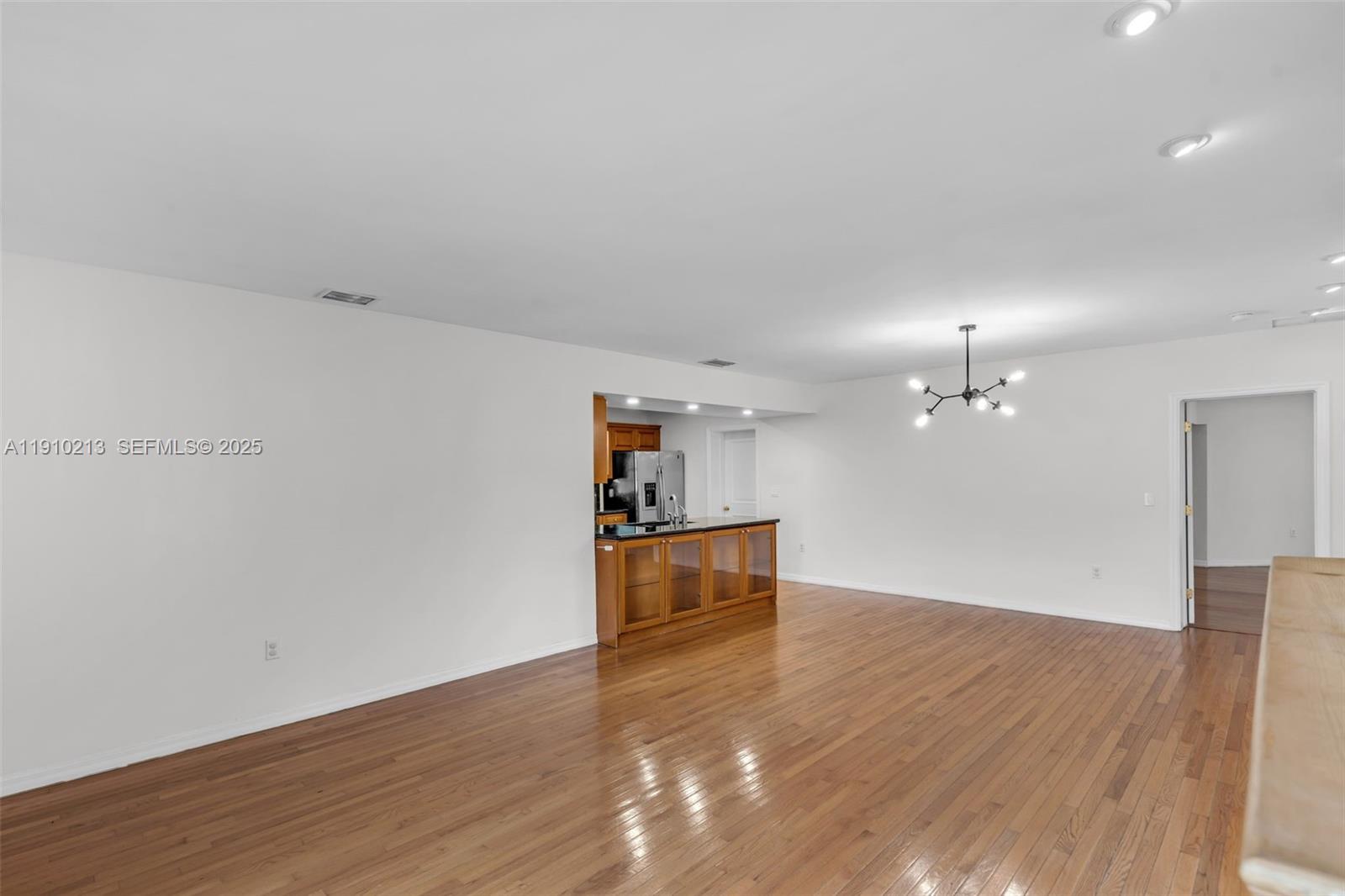 4416 Southwest 14th Street Miami, FL 33134 - Photo 5 of 33 an empty room with wooden floor