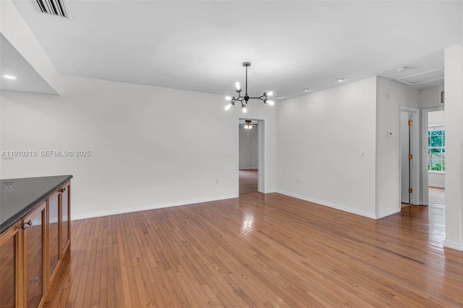 4416 Southwest 14th Street Miami, FL 33134 - Photo 7 of 33 a view of a livingroom with wooden floor