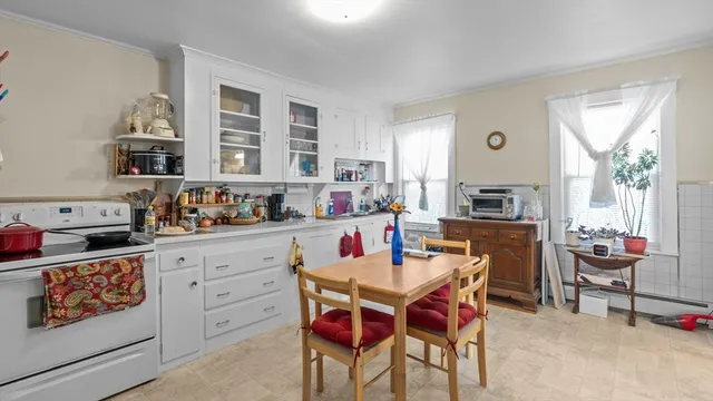 a kitchen with refrigerator and stove