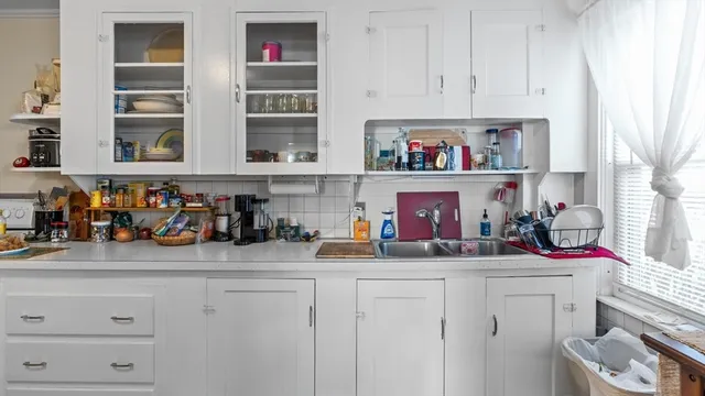 a kitchen with a refrigerator and a stove