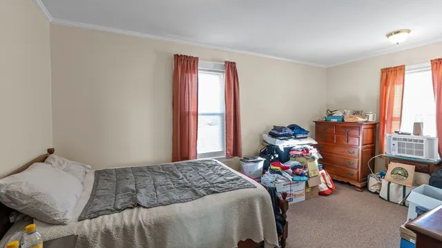 a room with a bed and furniture