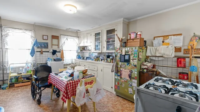 a room that has a lot of countertop and cabinets