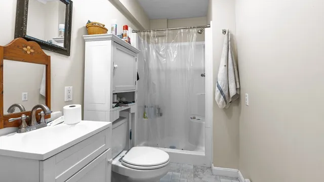 a bedroom with bed and a window