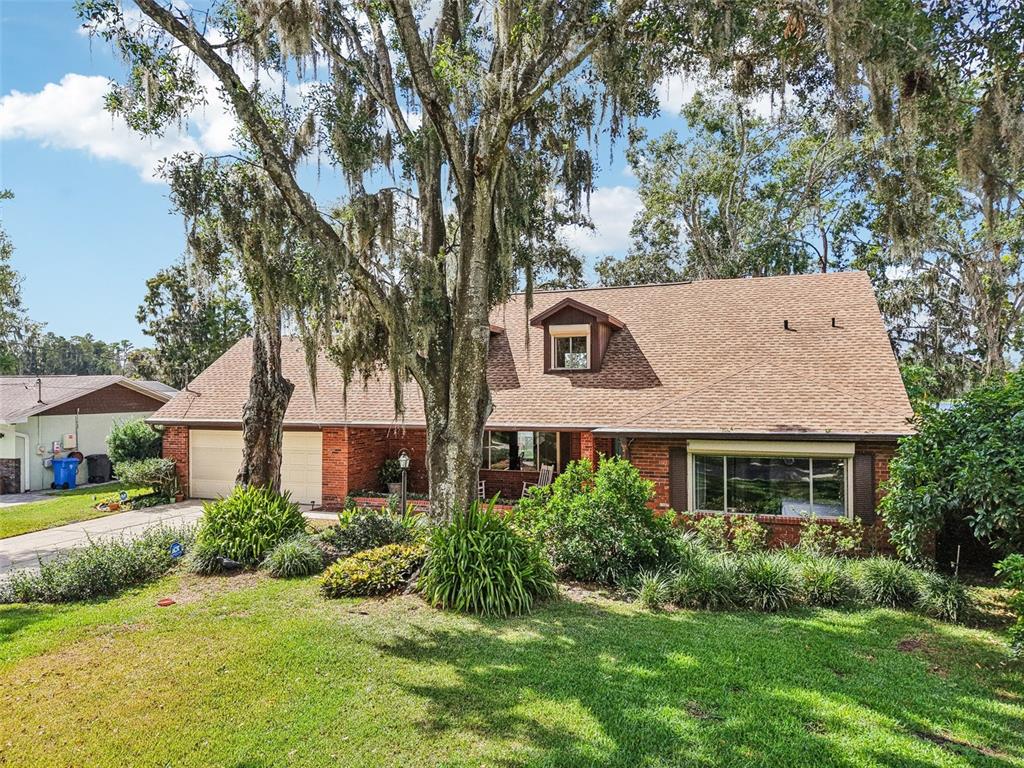 19254 Blount Road Lutz, FL 33558 - Photo 2 of 34 front view of a house with a yard