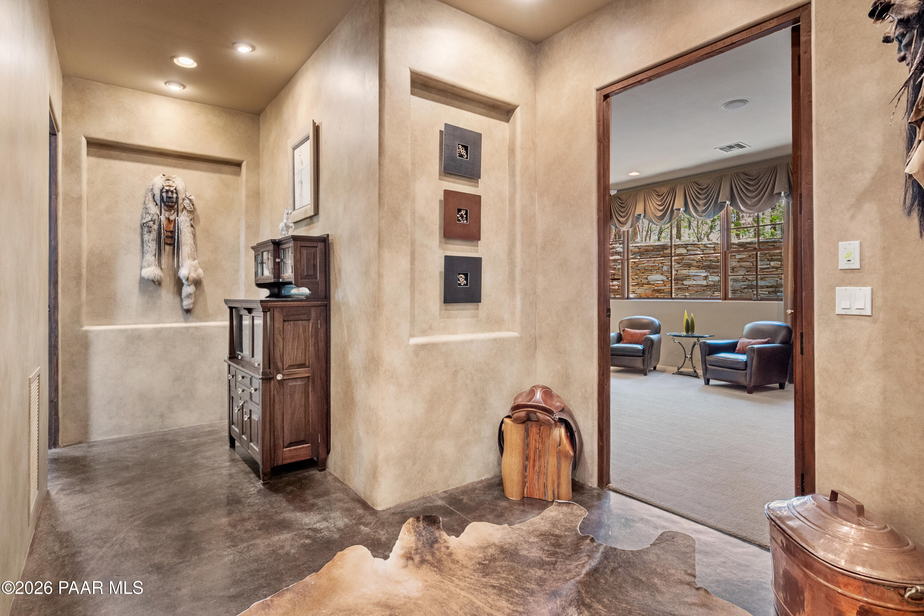 1515 High Valley Ranch Road Prescott, AZ 86303 - Photo 36 of 76 a living room with furniture a flat screen tv and a refrigerator
