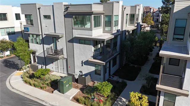 an aerial view of a house with outdoor space
