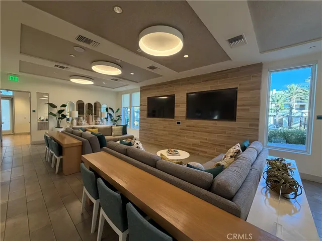 a large kitchen with a table and chairs