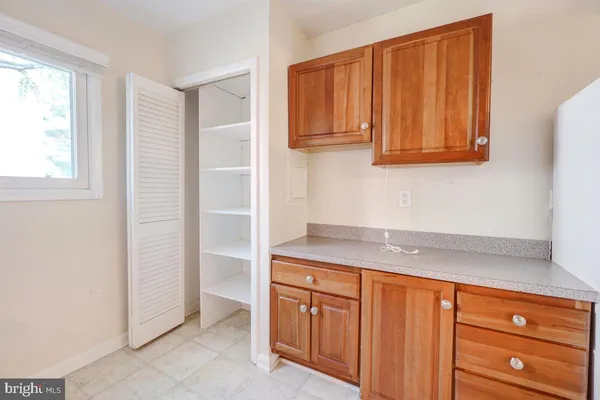 a view of cabinets and window
