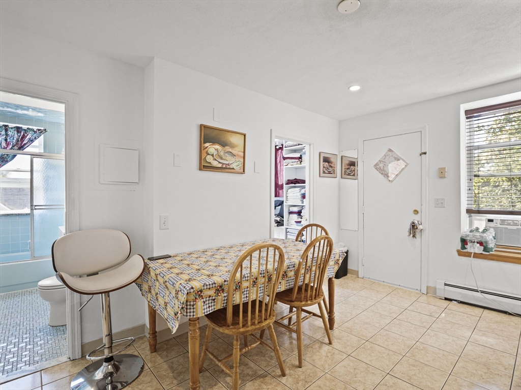 95 Florida Street, Unit 2 Boston, MA 02124 - Photo 10 of 29 a view of a livingroom with furniture and a table