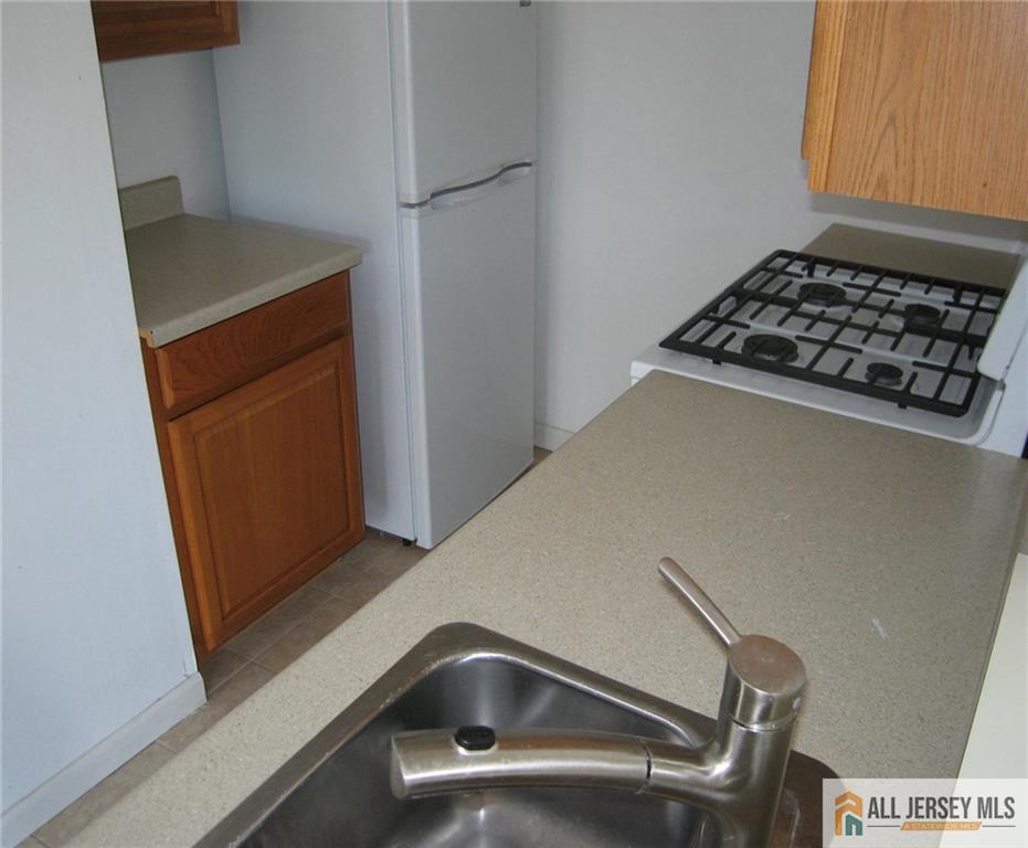 83 Crosspointe Drive, Unit 83 East Brunswick, NJ 08816 - Photo 4 of 11 a close view of utility room
