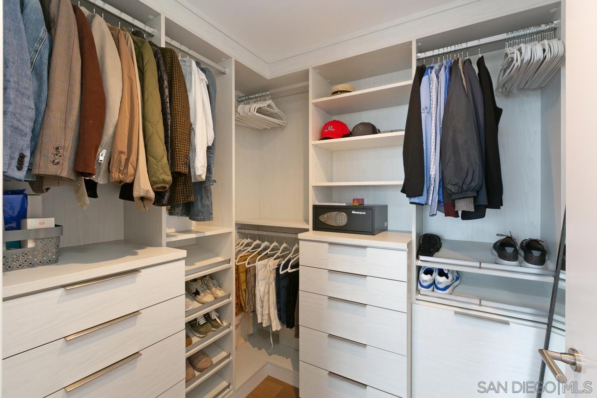 888 E Street, Unit 3501 San Diego, CA 92101 - Photo 20 of 46 a view of walk in closet with clothes and shoes
