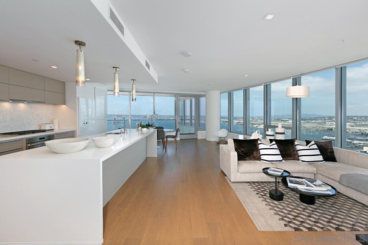 888 E Street, Unit 3501 San Diego, CA 92101 - Photo 2 of 46 a large living room with lots of furniture and a large window