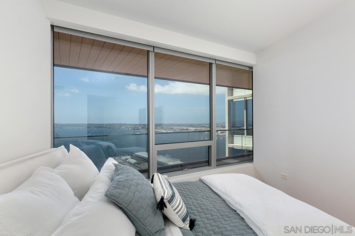 888 E Street, Unit 3501 San Diego, CA 92101 - Photo 23 of 46 a living room with a couch and a floor to ceiling window