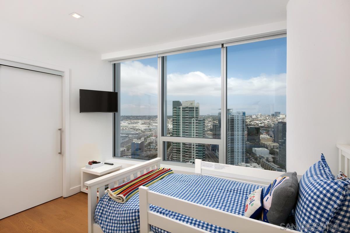 888 E Street, Unit 3501 San Diego, CA 92101 - Photo 27 of 46 a bed room with a bed and a television