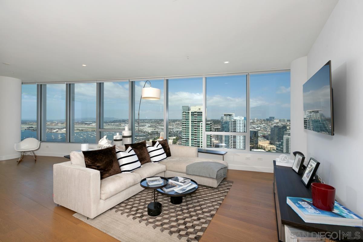 888 E Street, Unit 3501 San Diego, CA 92101 - Photo 3 of 46 a living room with furniture and a floor to ceiling window
