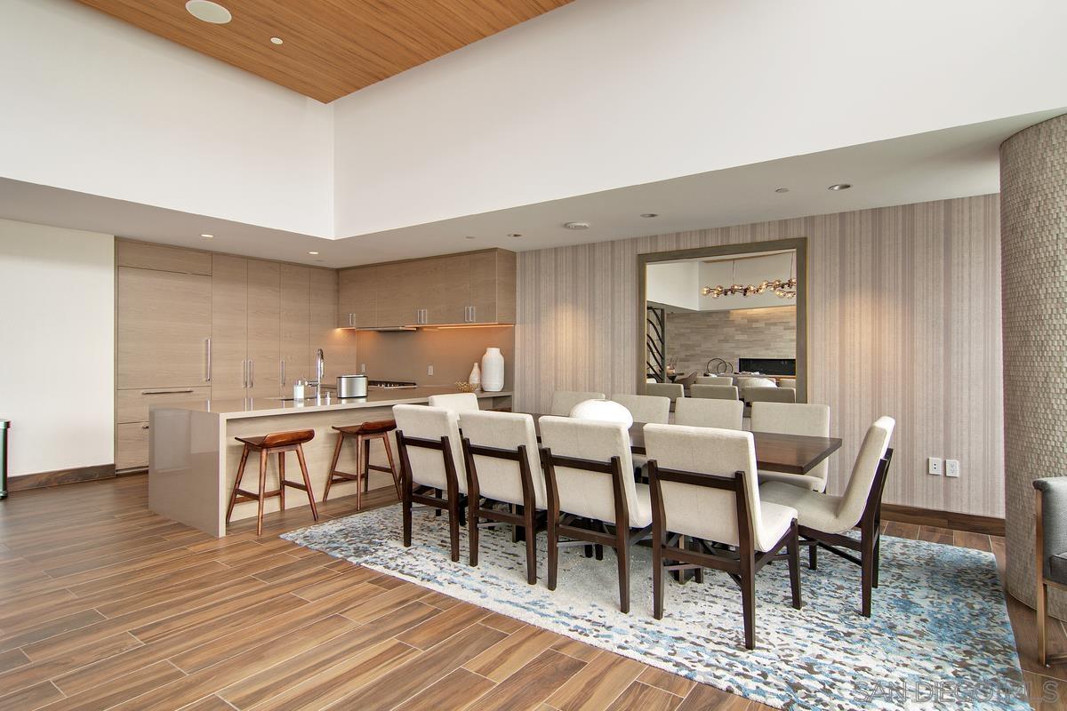 888 E Street, Unit 3501 San Diego, CA 92101 - Photo 42 of 46 a view of a dining room with furniture and wooden floor