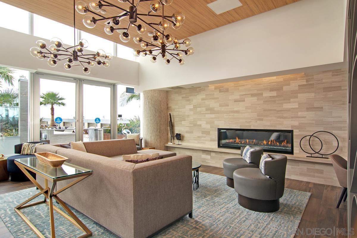 888 E Street, Unit 3501 San Diego, CA 92101 - Photo 43 of 46 a living room with furniture a chandelier and a fireplace