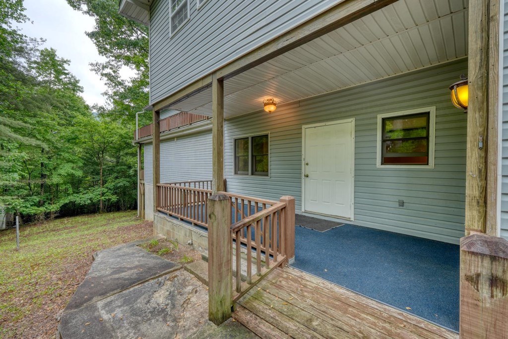 1066 Ridge Road Hiawassee, GA 30546 - Photo 6 of 51 a view of house with deck and outdoor seating