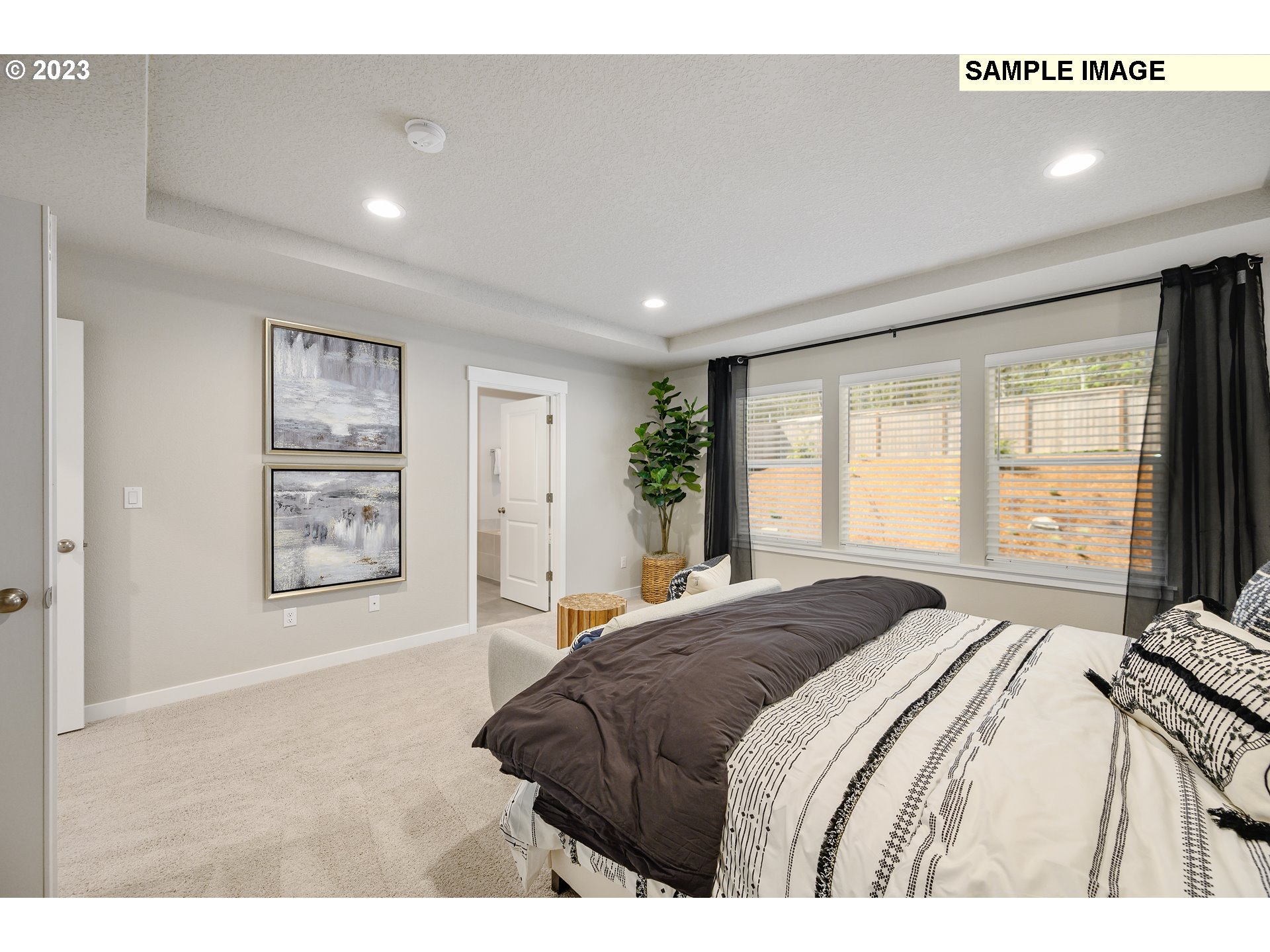 18660 Warm Springs Street, Unit 10 Sandy, OR 97055 - Photo 23 of 42 a bedroom with a large bed and a window