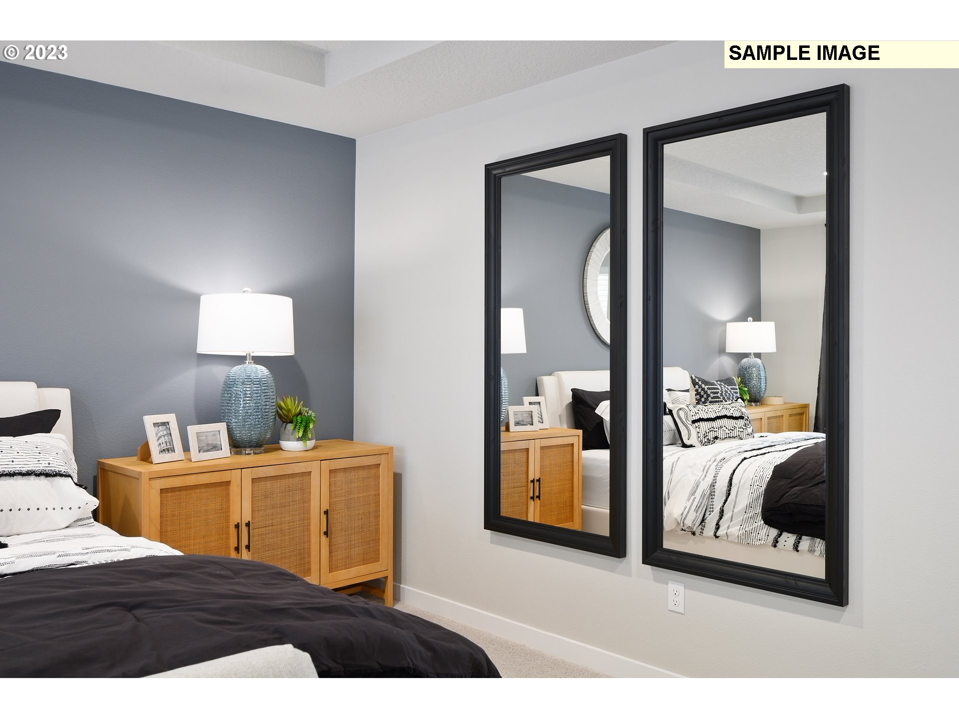 18660 Warm Springs Street, Unit 10 Sandy, OR 97055 - Photo 26 of 42 a bedroom with a bed and a mirror