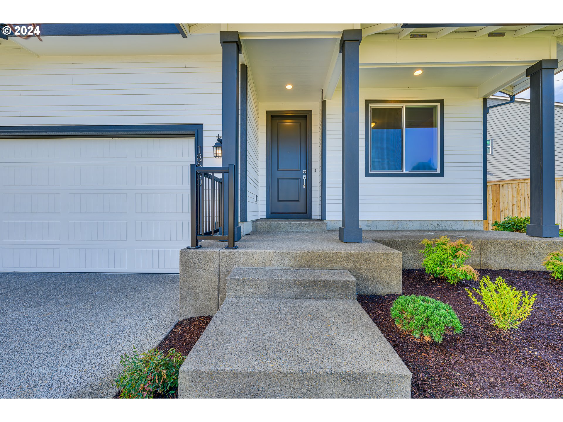 18660 Warm Springs Street, Unit 10 Sandy, OR 97055 - Photo 3 of 42 a front view of a house with garden