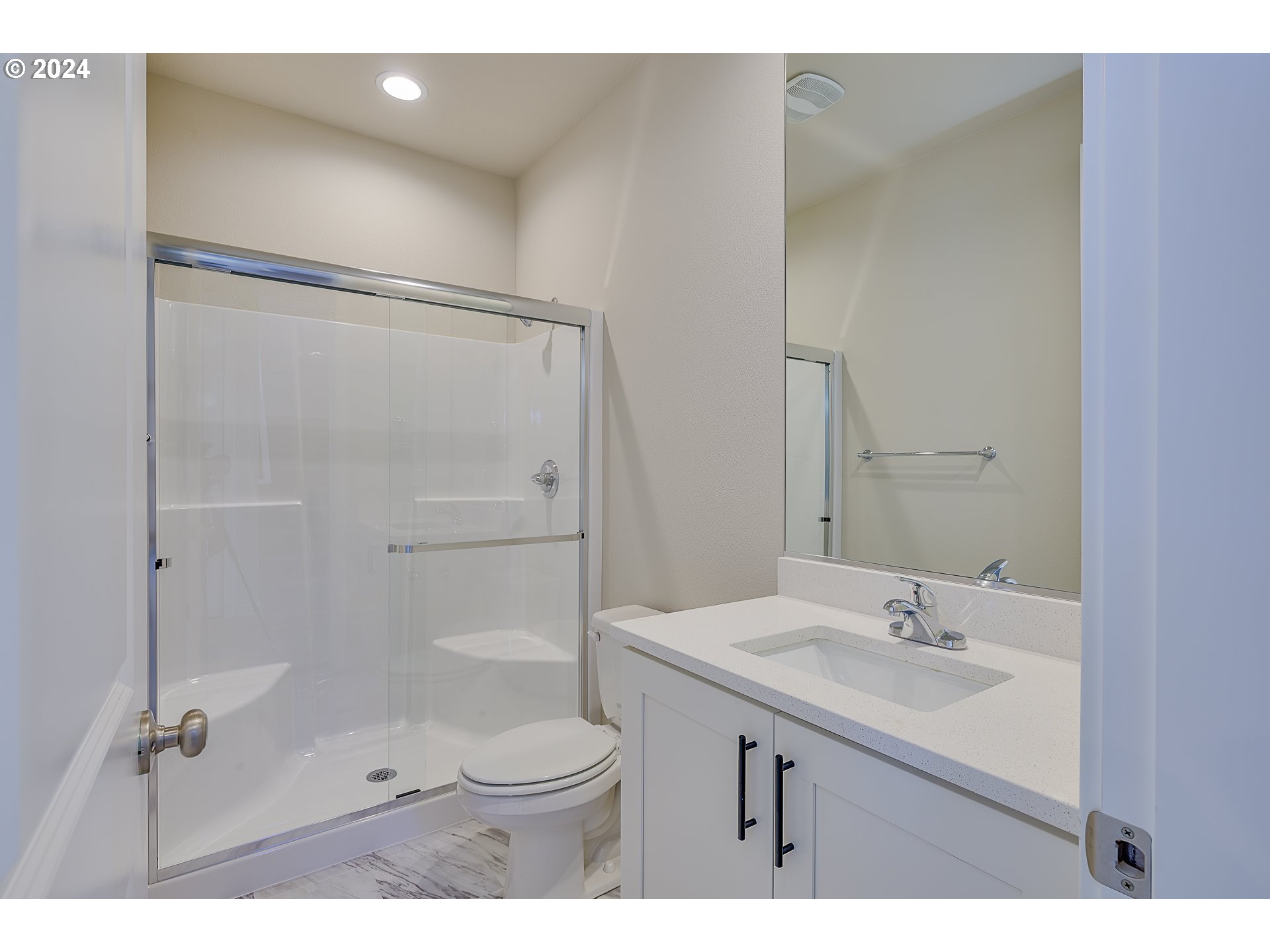 18660 Warm Springs Street, Unit 10 Sandy, OR 97055 - Photo 37 of 42 a bathroom with a sink toilet a mirror and shower