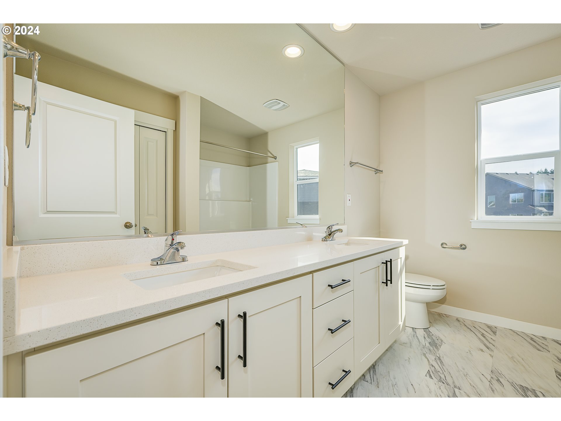 18660 Warm Springs Street, Unit 10 Sandy, OR 97055 - Photo 38 of 42 a bathroom with a granite countertop sink a toilet and a mirror