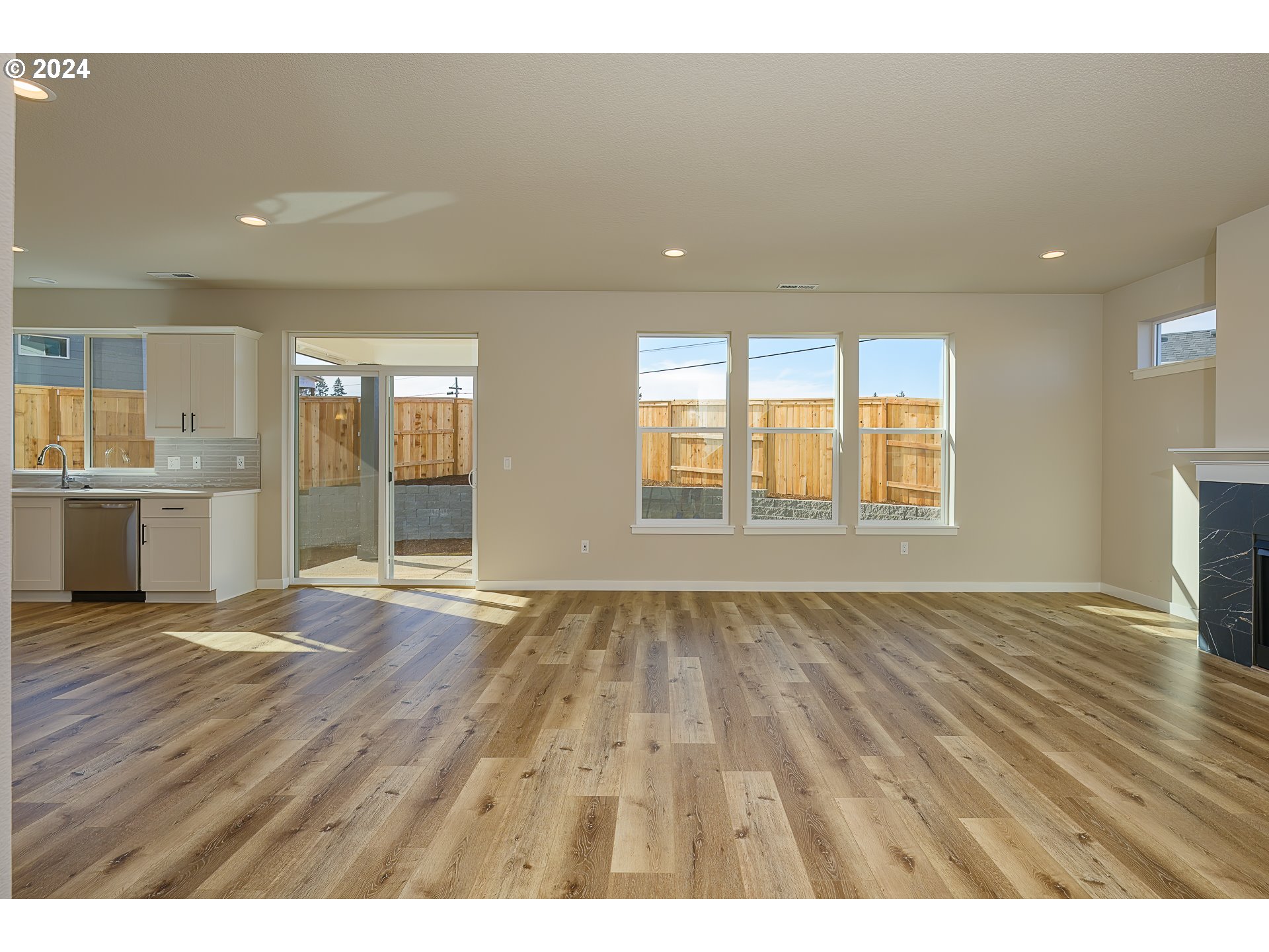 18660 Warm Springs Street, Unit 10 Sandy, OR 97055 - Photo 6 of 42 an empty room with wooden floor and windows