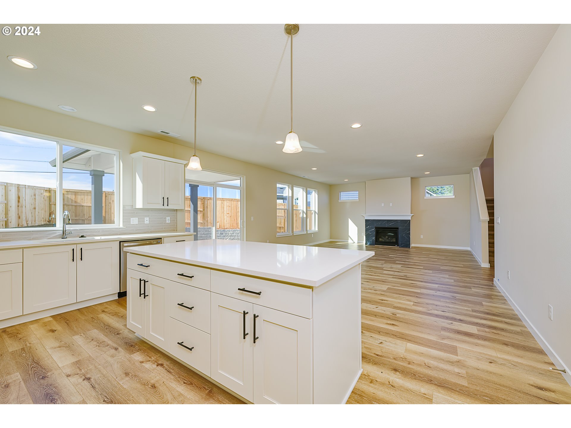 18660 Warm Springs Street, Unit 10 Sandy, OR 97055 - Photo 8 of 42 a kitchen with kitchen island a sink stainless steel appliances and cabinets