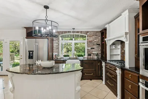 a living room with fireplace furniture and a flat screen tv