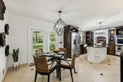 a kitchen with a sink and a large window