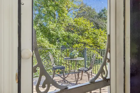 a bathroom with bathtub and mirror
