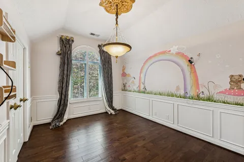 a view of a chair and tables in the balcony