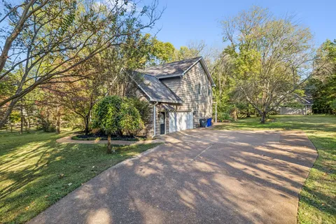 a backyard of a house with lots of green space