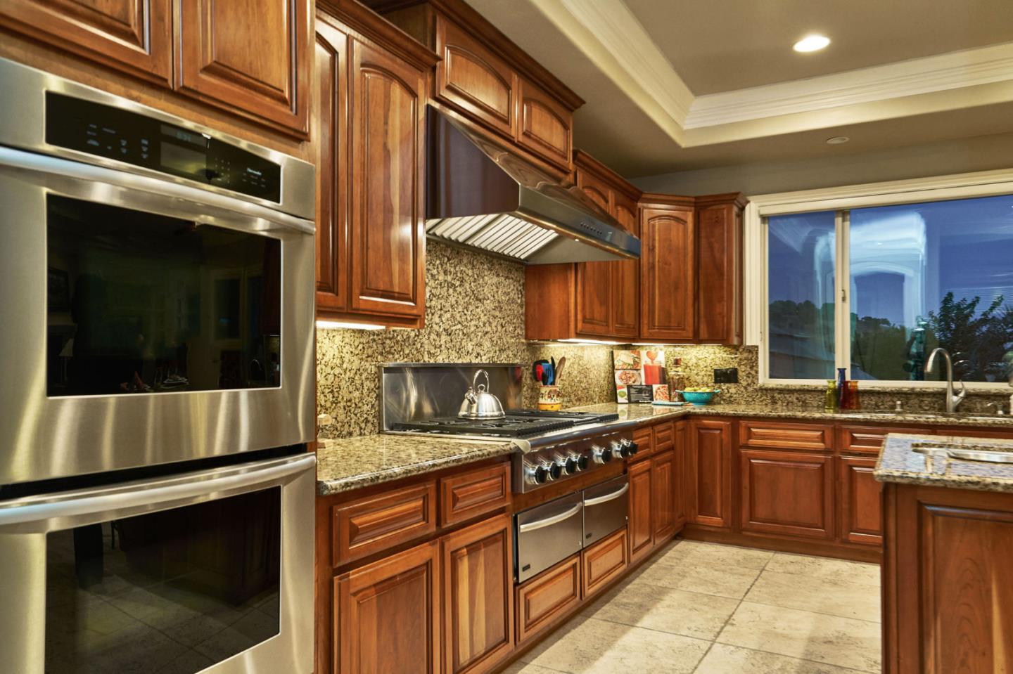 13800 Watsonville Road Morgan Hill, CA 95037 - Photo 16 of 74 a kitchen with stainless steel appliances granite countertop a stove a sink and a microwave