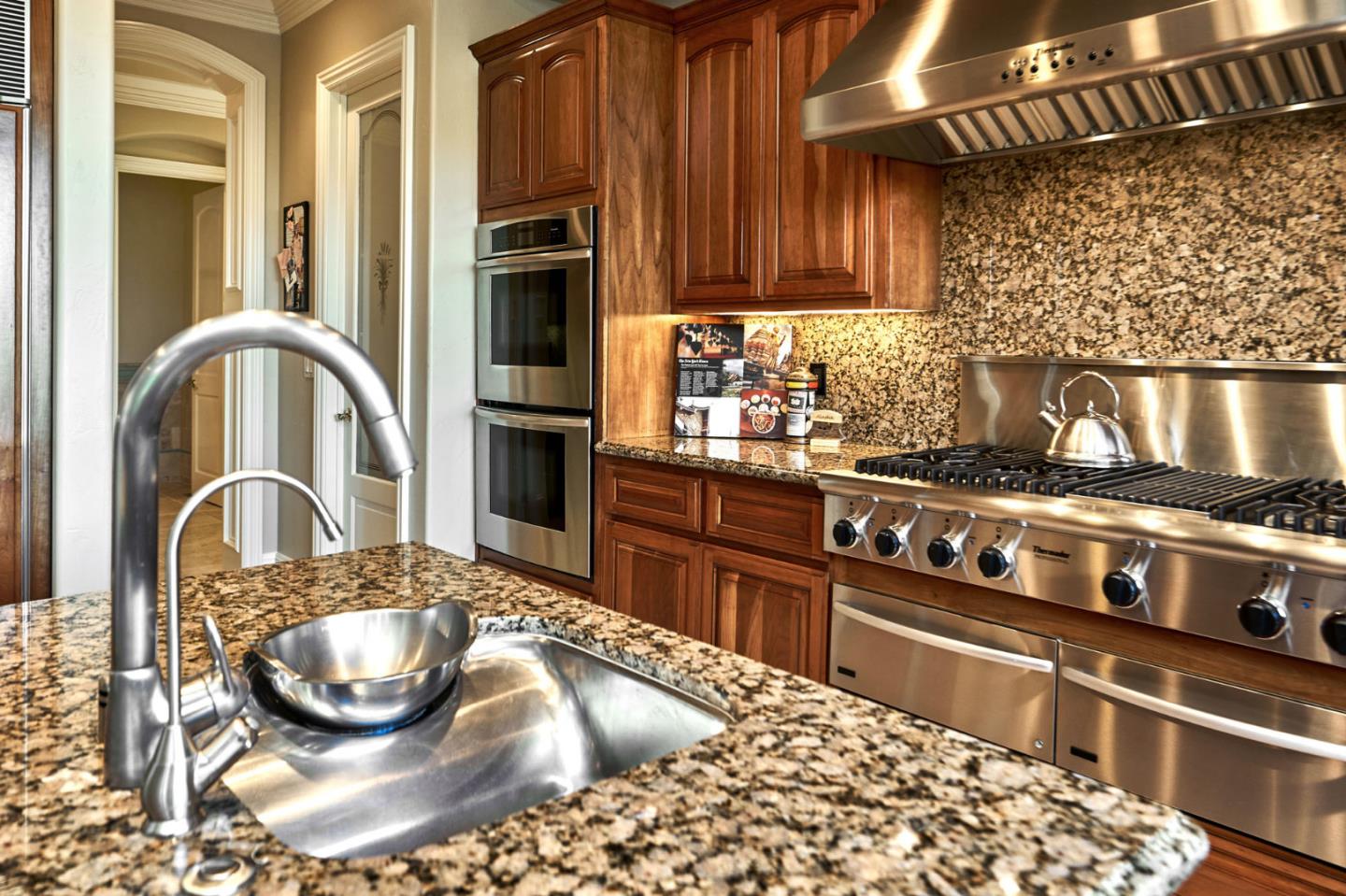13800 Watsonville Road Morgan Hill, CA 95037 - Photo 17 of 74 a kitchen with stainless steel appliances granite countertop a stove a sink and a microwave