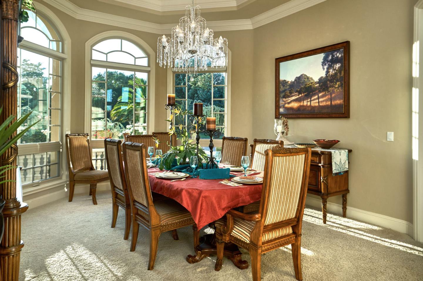 13800 Watsonville Road Morgan Hill, CA 95037 - Photo 30 of 74 a view of a dining room with furniture a chandelier and wooden floor
