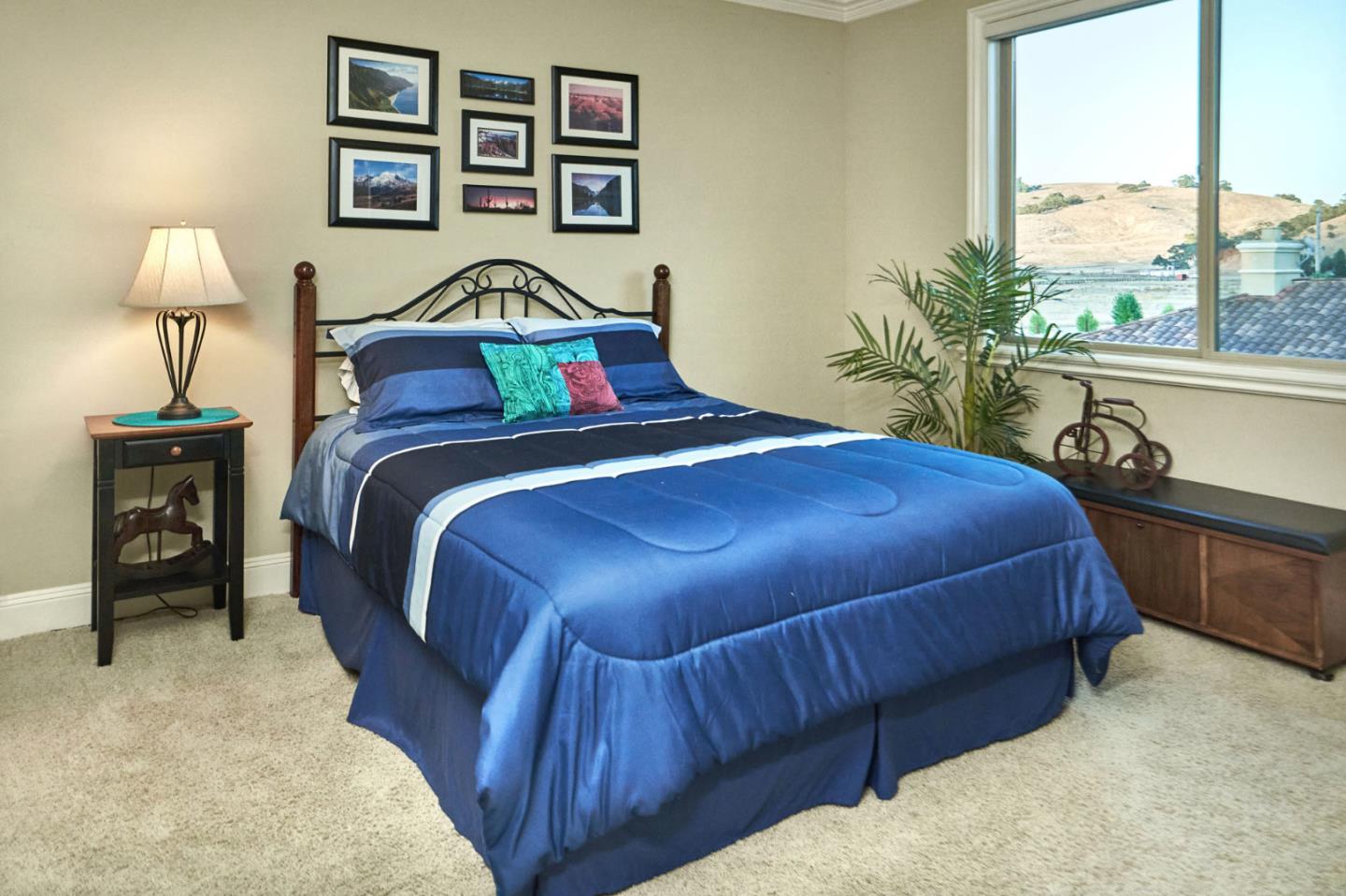 13800 Watsonville Road Morgan Hill, CA 95037 - Photo 52 of 74 a bedroom with a bed and a painting on the wall