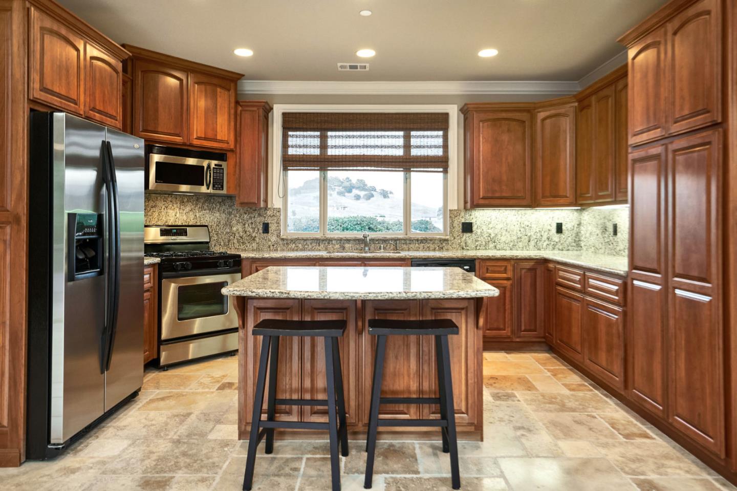 13800 Watsonville Road Morgan Hill, CA 95037 - Photo 68 of 74 a kitchen with stainless steel appliances granite countertop a stove a sink refrigerator and a microwave