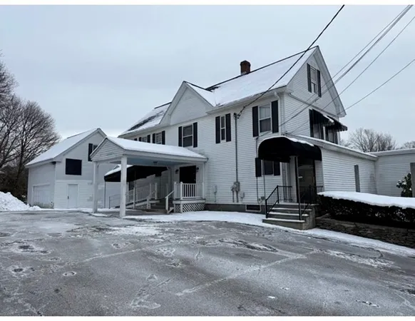 a front view of a house with parking
