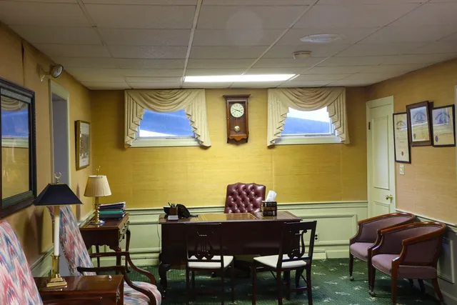 a view of a workspace with furniture