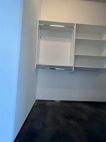 a view of an empty walk in closet